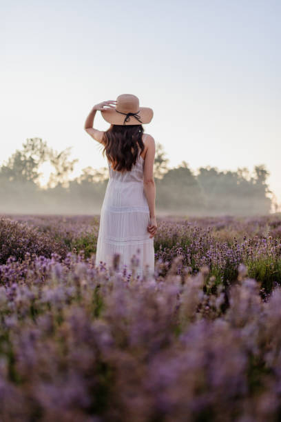 istock Woman in lavender field 1284799490