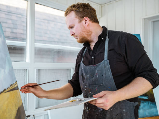istock Man painting art in his studio 1284799524