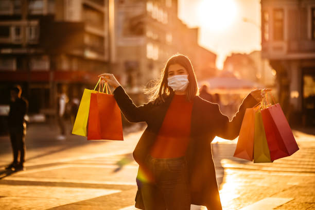 istock Woman shopping with face mask 1284800906