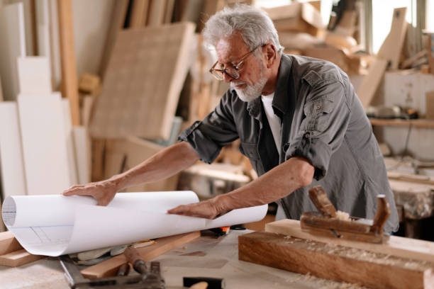 istock Mature carpenter at work stock photo 1284801394