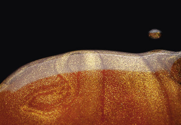 istock Golden gel on black background 1284802529