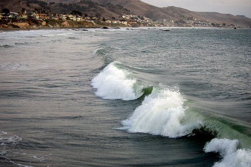 Ocean waves in the bay in Cayuco bay San Luis Obispo county California. Shot take late afternoon.