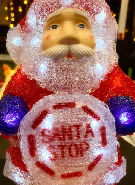 istock Santa Claus figurine with a stop sign 1284806398