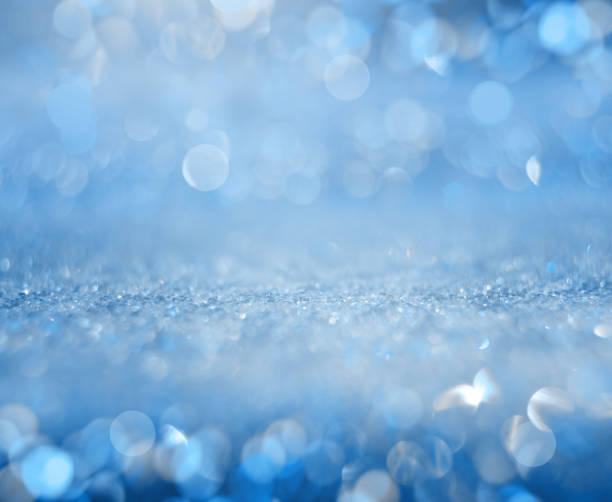 istock Glowing blurred blue background. Festive winter concept. 1284811526