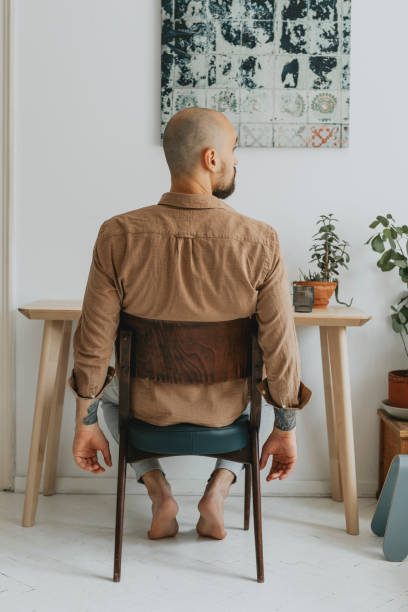 istock Anonymous Young Businessman Sitting in his Improvised Home Office, Adapting to the New Work Environment 1284813497