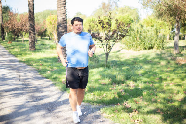 istock overweight Man running for weight loss 1284817219