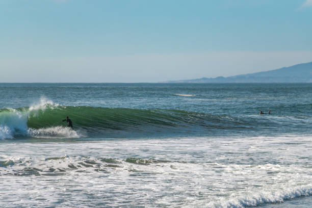 istock Big surfing waves break near San Francisco, California 1284818410