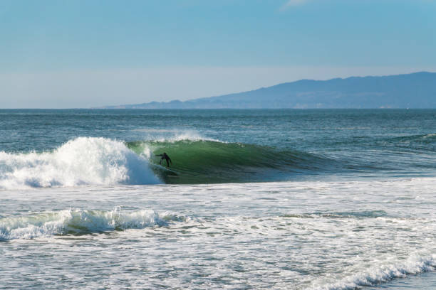 istock Big surfing waves break near San Francisco, California 1284818432