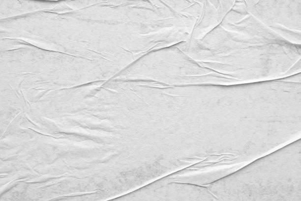 istock Blank white crumpled and creased paper poster texture background 1284822178