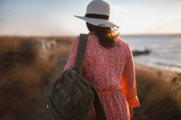 istock Young Female Traveler With Backpack And Straw Hat 1284822325