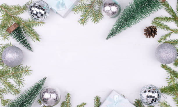 istock Frame of Christmas decorations on a white background,tree branches, cones, gifts Flatlay, CopySpace, New year 2021 1284822994