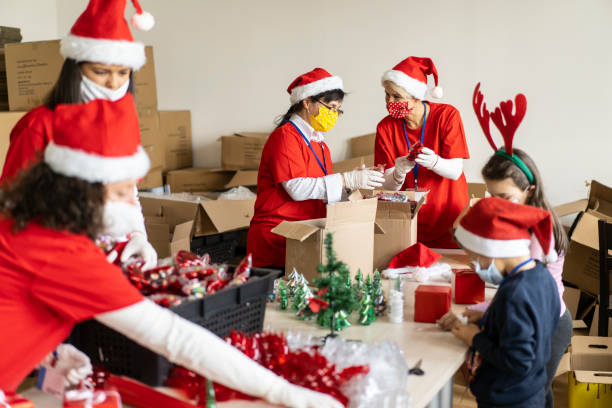 istock Volunteers packing Christmas gifts 1284823084