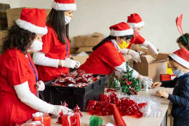 istock Volunteers packing Christmas gifts 1284823085