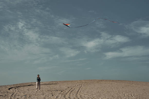 istock The girl launches a kite. Camping, hobby. 1284823739