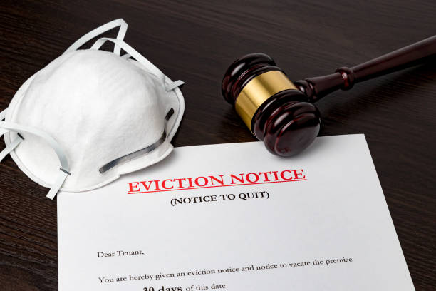 Eviction notice document with gavel and N95 face mask. Concept of financial hardship, housing crisis and mortgage payment default during Covid-19 coronavirus pandemic. background, no people eviction photos stock pictures, royalty-free photos & images