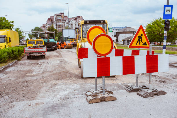istock Laying new layer of asphalt. Road repair work. 1284828667
