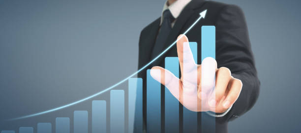 istock Businessman plan graph growth and increase of chart positive indicators in his business 1284834990