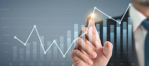 istock Businessman plan graph growth and increase of chart positive indicators in his business 1284834995