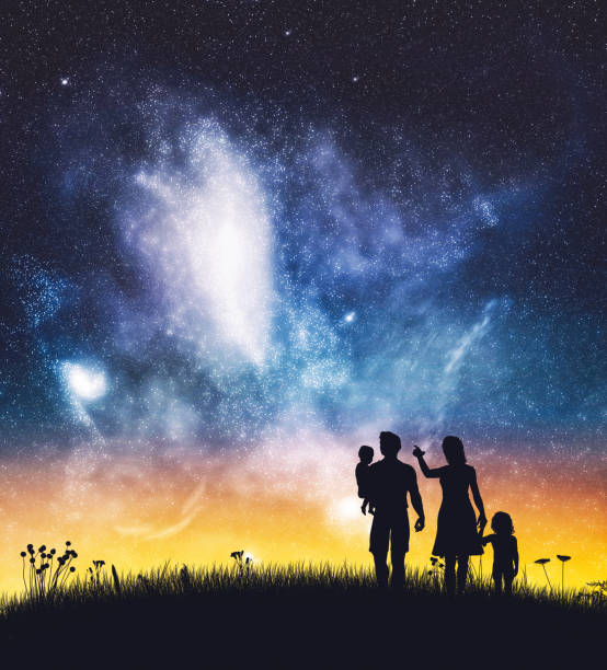 istock Parents with their children on a night sky. 1284835023