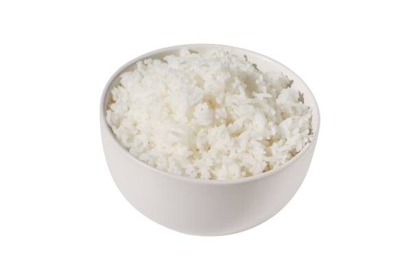 istock Steamed rice in white ceramics bowl isolated on white background. 1284836518
