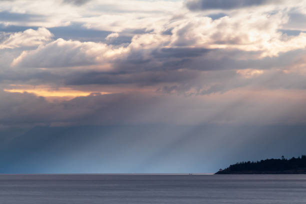 istock Beams Of Light Through The Clouds 1284842683