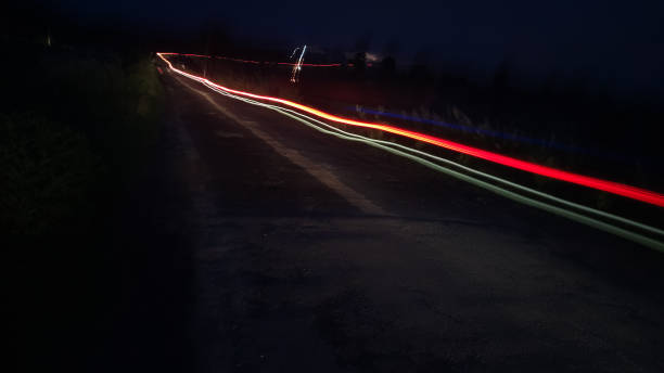 istock long light trail photo in a village road 1284845153