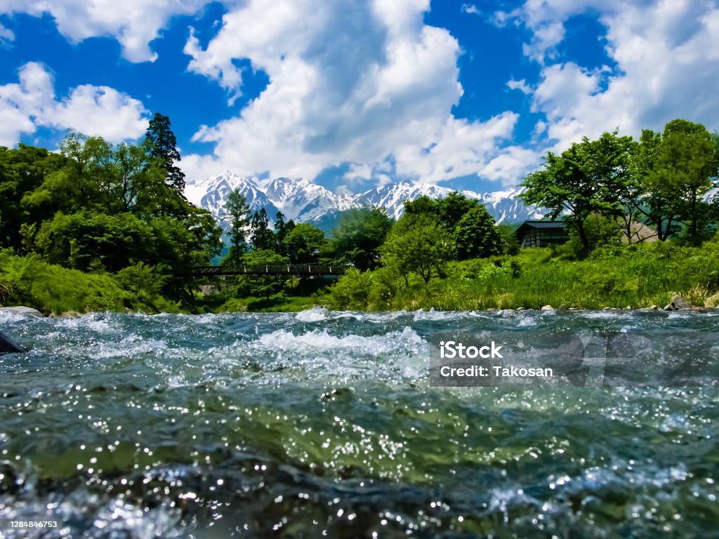 Torrent of Hime-river Hakuba Nagano 1/Jun/2008 : Early summer scene of Hakuba village, Torrent of Hime-river and Hakuba mountain range Mountain Stock Photo