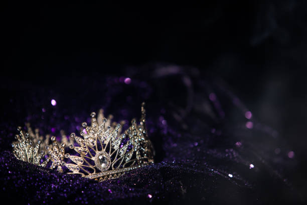 Diamond Silver Crown Miss Pageant Beauty Contest Diamond Silver Crown for Miss Pageant Beauty Queen Contest, Crystal Tiara jewelry decorated gems stone and Bokeh sparking abstract dark background copy space banner beauty queen stock pictures, royalty-free photos & images
