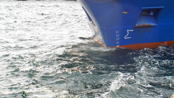 istock Bow of a Ship Swinging on Waves Moored in Harbour 1284854806