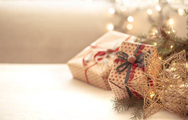 istock Christmas background with decorative star and gift box on blurred background. 1284856908