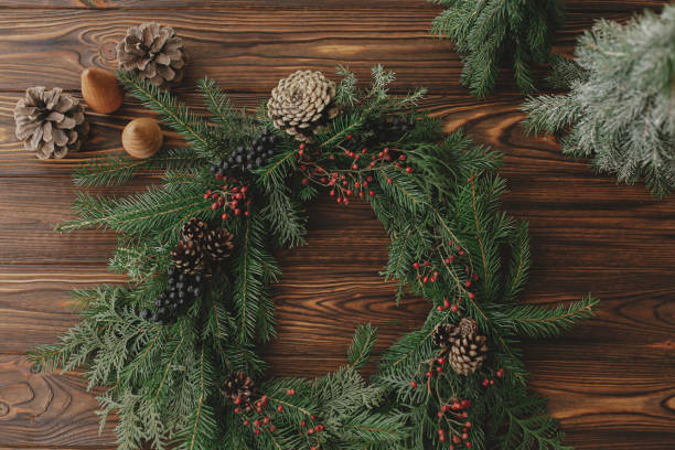 istock Rustic christmas wreath on wooden table flat lay. Holiday workshop 1284857730