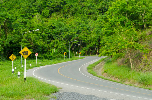 istock Asphalt winding curve road in nature 1284861039