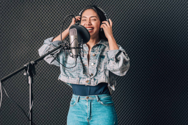 istock asian woman in music studio recording 1284861263