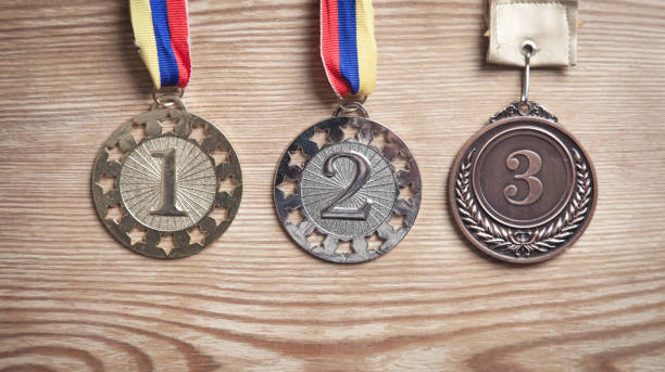 istock Medal awards for winner on wood background. 1284862602