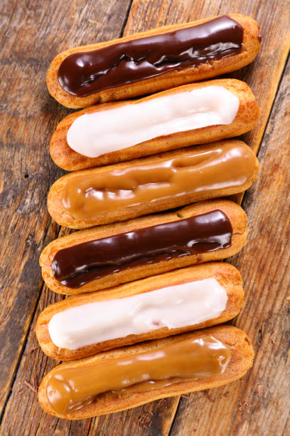istock chocolate, vanilla and coffee eclair- french traditional pastry 1284863954