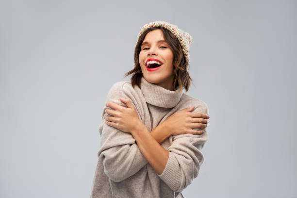 young woman in knitted winter hat and sweater