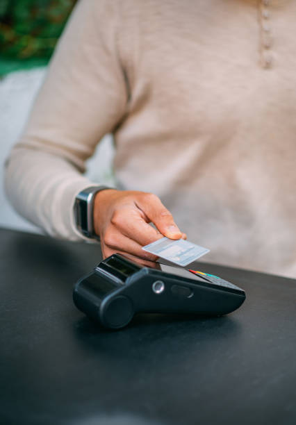 istock Making Contactless Payment With Credit Card at Cafe 1284871397