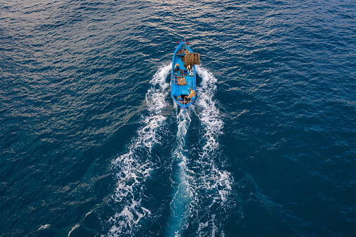 Drone view of a fishing boat is coming home after a fishing trip, Khanh Hoa province, central Vietnam