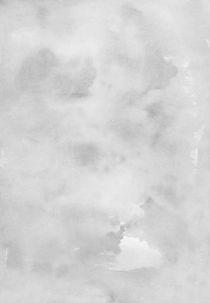 istock Watercolor light white and gray background texture. Grey stains on paper 1284873744