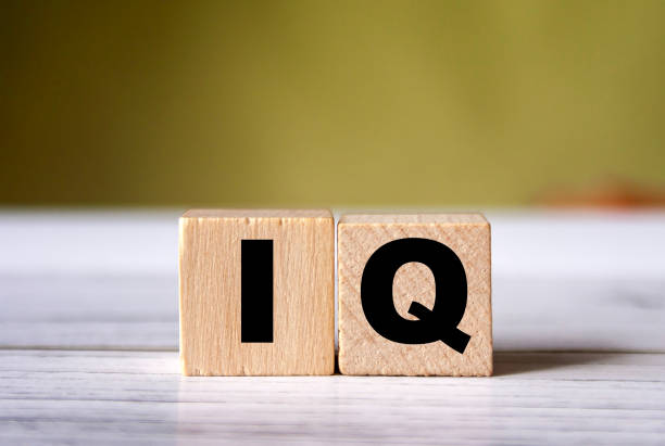 istock IQ word concept on wooden cube.  Intelligence symbol. Brain or talent background idea 1284877645