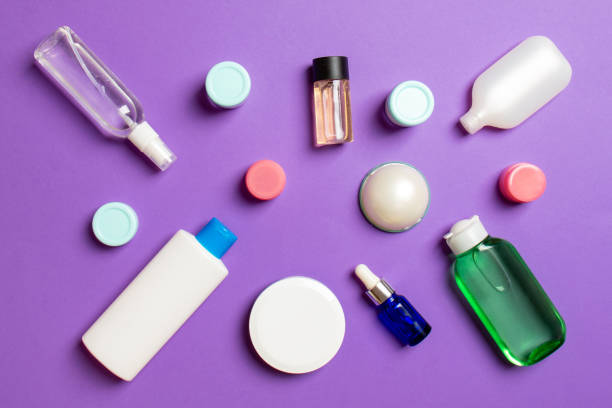 istock Group of plastic bodycare bottle Flat lay composition with cosmetic products on colored background empty space for you design. Set of White Cosmetic containers, top view with copy space 1284879172