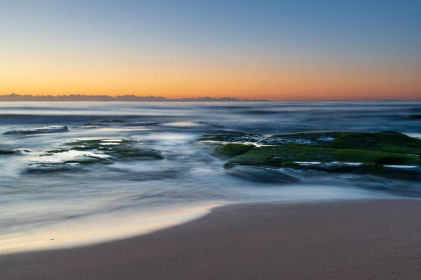 istock Clear skies and soft seas, dawn at the beach 1284879252