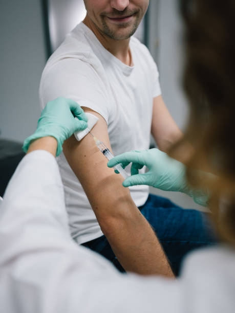 istock young doctor administering a dose of vaccine 1284886021