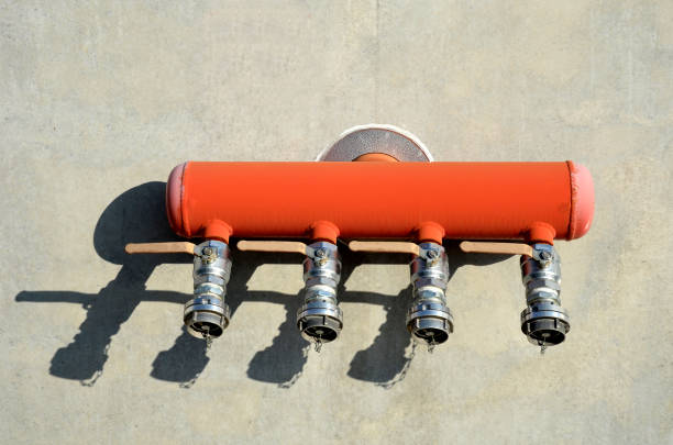 red switchboard for fire hoses designed for connecting fire hoses. four taps and b couplings for bayonet quick connection. large amount of water to extinguish a fire on the wall of the building. water cap, ball valve rescue, sale, accidents and disasters, pump, flame, hospital, hydrant, modern, red, switchboard, fire, hoses, hose, designed, connecting, four, taps, b, coupling, bayonet, quick, connection, large, amount, water, extinguish, wall, building, cap, ball, valve, steel, concrete, gary, silver, huge, extinguisher, fireman, firefighter, sprinkler, station, outcome, safety, protection, cylinder, shadow, closed, capacity, squirt, spout fire letter b stock pictures, royalty-free photos & images