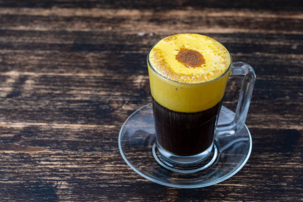 Traditional vietnamese egg coffee made of raw egg yolk and condensed milk, close up stock photo