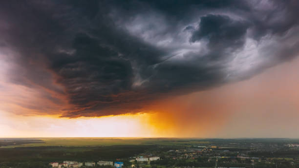 istock Stormy Sunset Sky Before Rain Above Skyline. Dramatic Cloudy Sky And Flash Light 1284891401