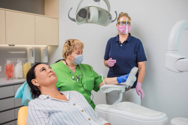 istock A female dentist working on a patient in a dental surgery 1284894063