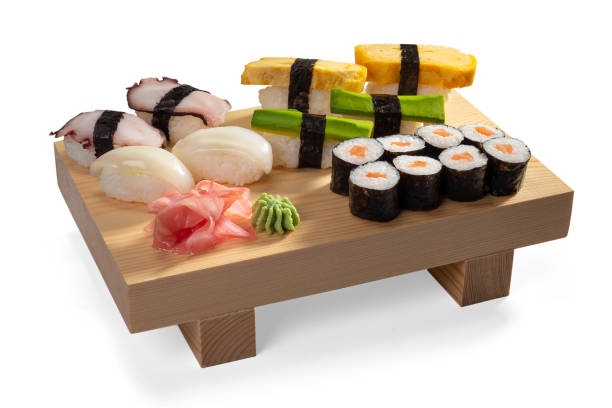 istock Sushi set and sushi rolls on a wooden board 1284894435
