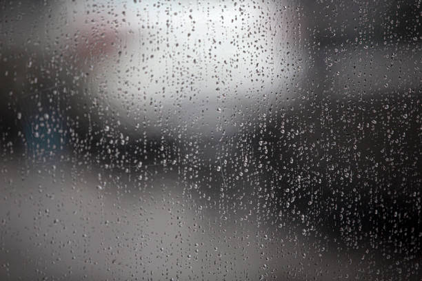 istock falling rain drops on the street 1284895689