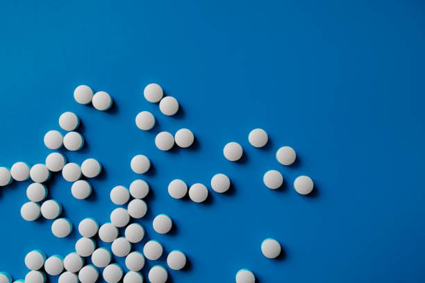 istock Assorted pharmaceutical medicine pills, tablets and capsules.Pills background. Heap of assorted various medicine tablets and pills different colors 1284896974